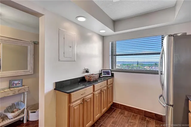 a kitchen with a sink and a refrigerator