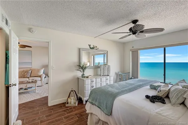 a bedroom with a bed and a desk