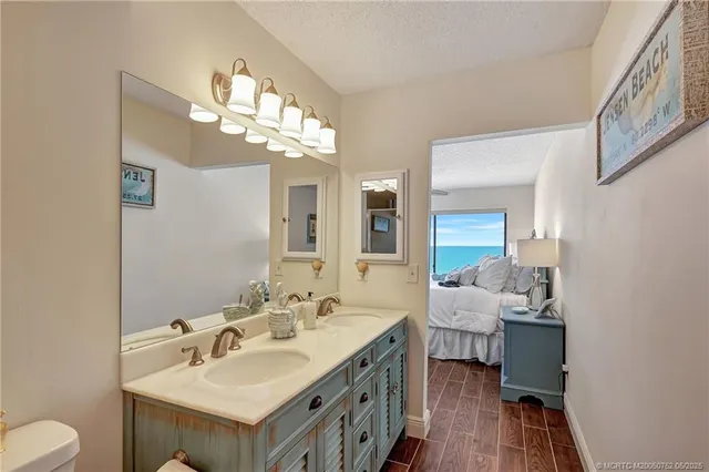 a bathroom with a sink vanity and a mirror