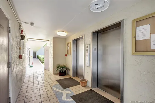 a bathroom with a glass shower door and a bathtub