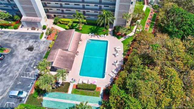 an aerial view of a house with outdoor space