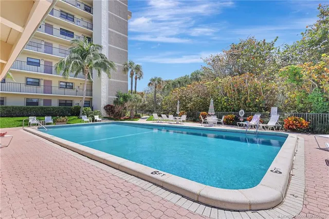 a view of a building with garden and plants