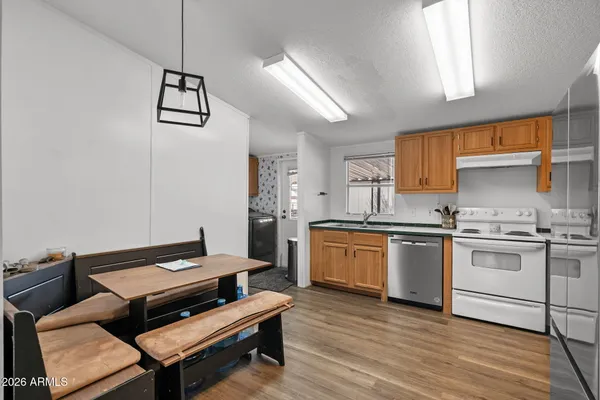 a kitchen with stainless steel appliances granite countertop a sink and cabinets
