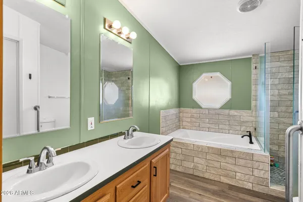 a bathroom with a bathtub and shower