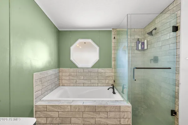 a bathroom with a sink vanity and a mirror