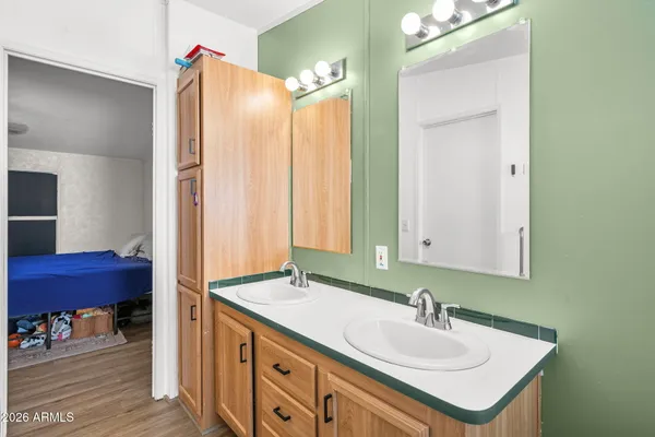 a bedroom with bed and a potted plant