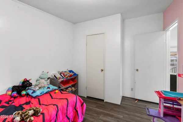 a kitchen with a refrigerator a sink and cabinets