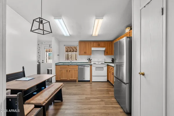 a bedroom with furniture and wooden floor