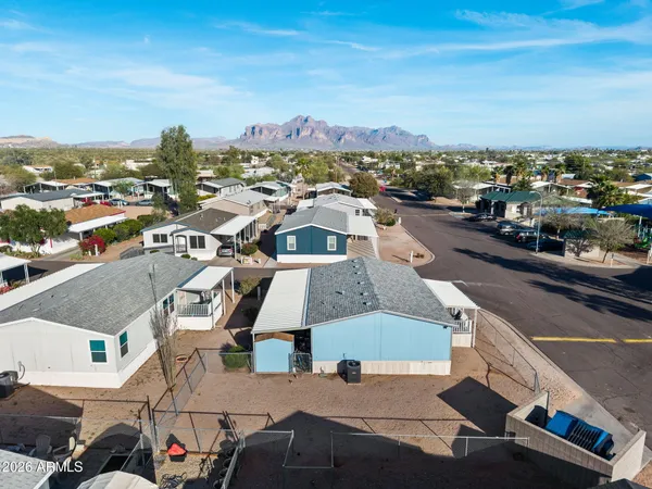 an aerial view of houses with outdoor space