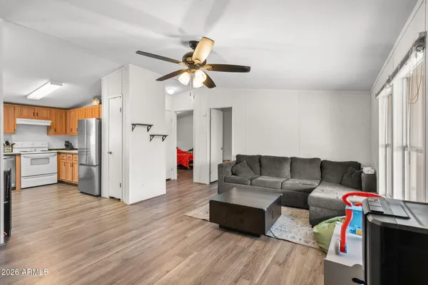 a kitchen with sink stove and cabinets
