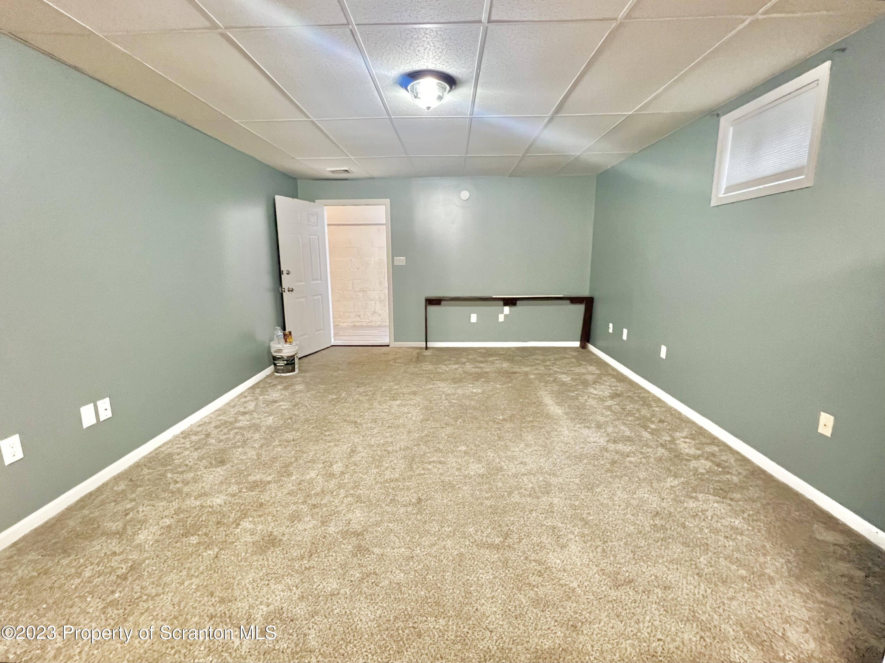 609 Mill Street, Unit 6 Dunmore, PA 18512 - Photo 4 of 10 a view of an empty room with a window