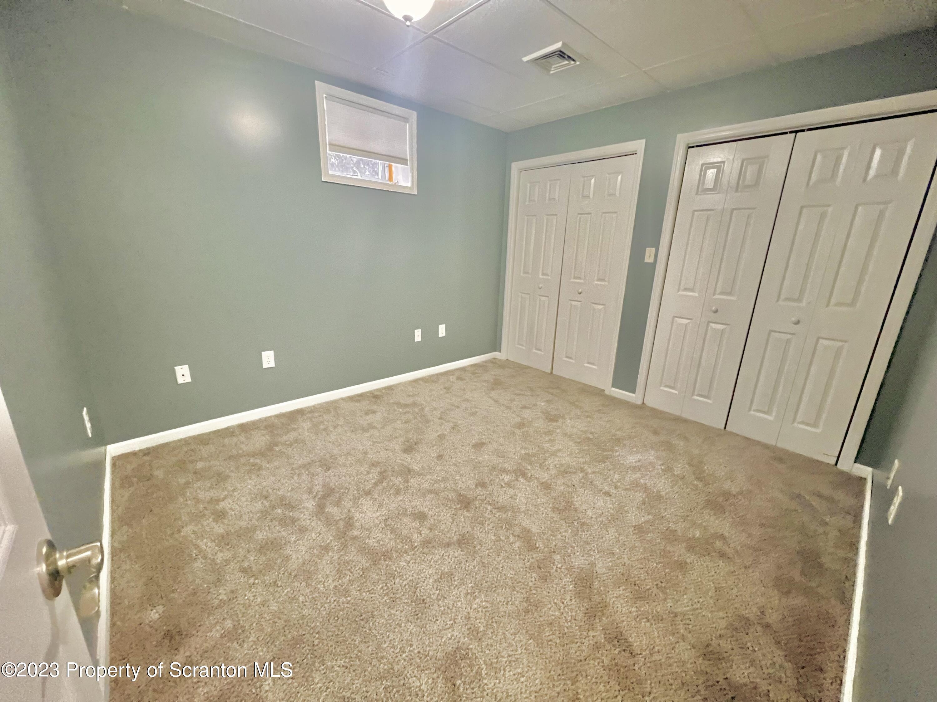609 Mill Street, Unit 6 Dunmore, PA 18512 - Photo 5 of 10 a view of a big room with window and stairs