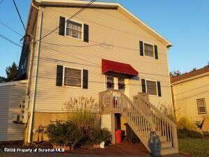 609 Mill Street, Unit 6 Dunmore, PA 18512 - Photo 9 of 10 a view of a house with wooden fence