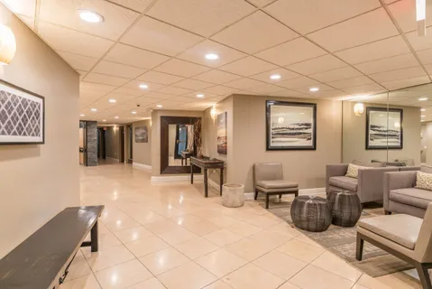 a lobby with furniture and a table