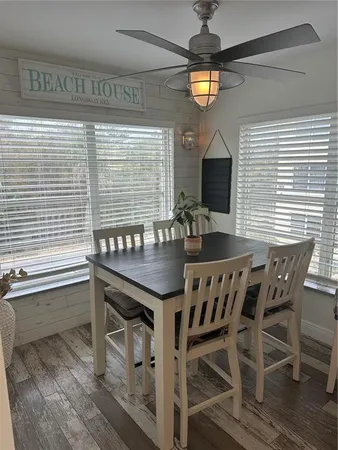 a view of a dining room with furniture and window