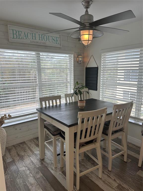 a view of a dining room with furniture and window
