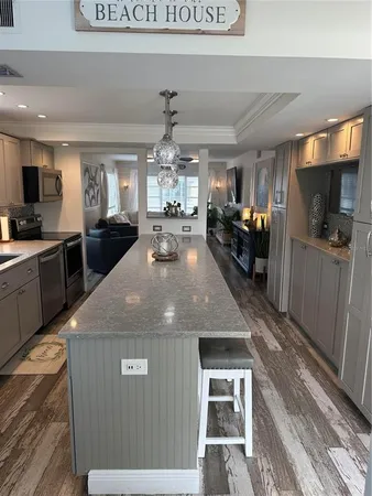 a kitchen with sink refrigerator and window