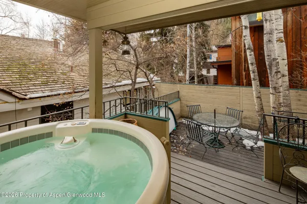 a swimming pool with outdoor seating