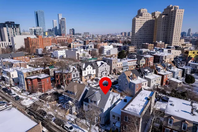 an aerial view of a city with lots of residential buildings