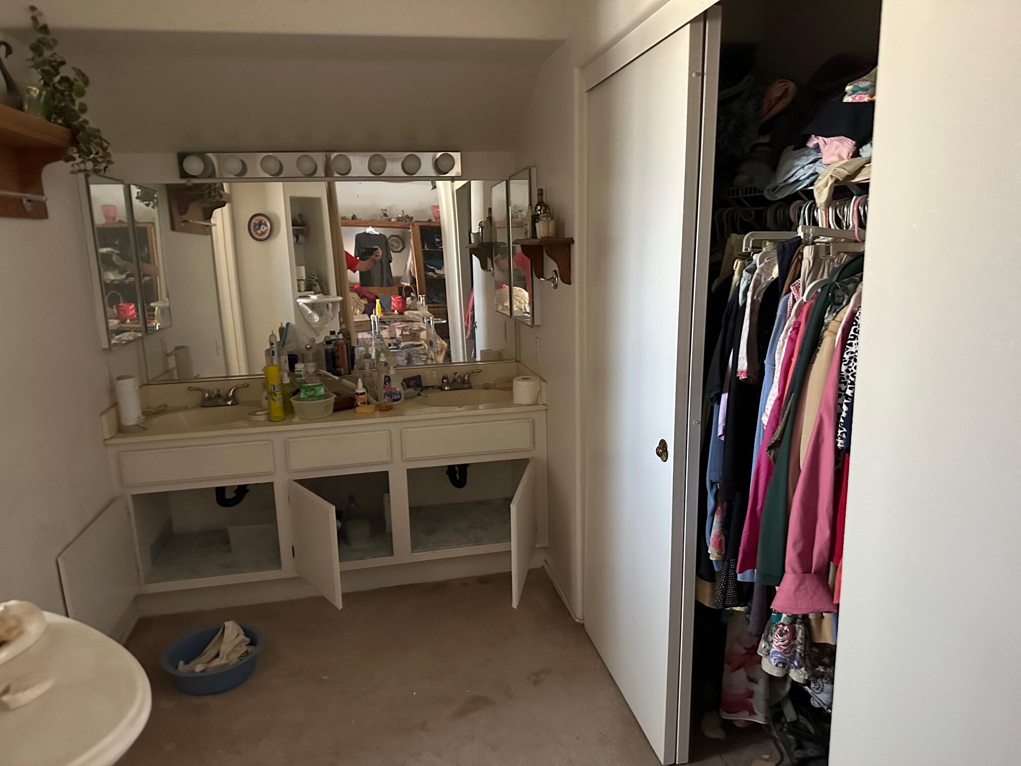 735 Blake Road Riverside, CA 92501 - Photo 13 of 24 a view of walk in closet with clothes and shoes