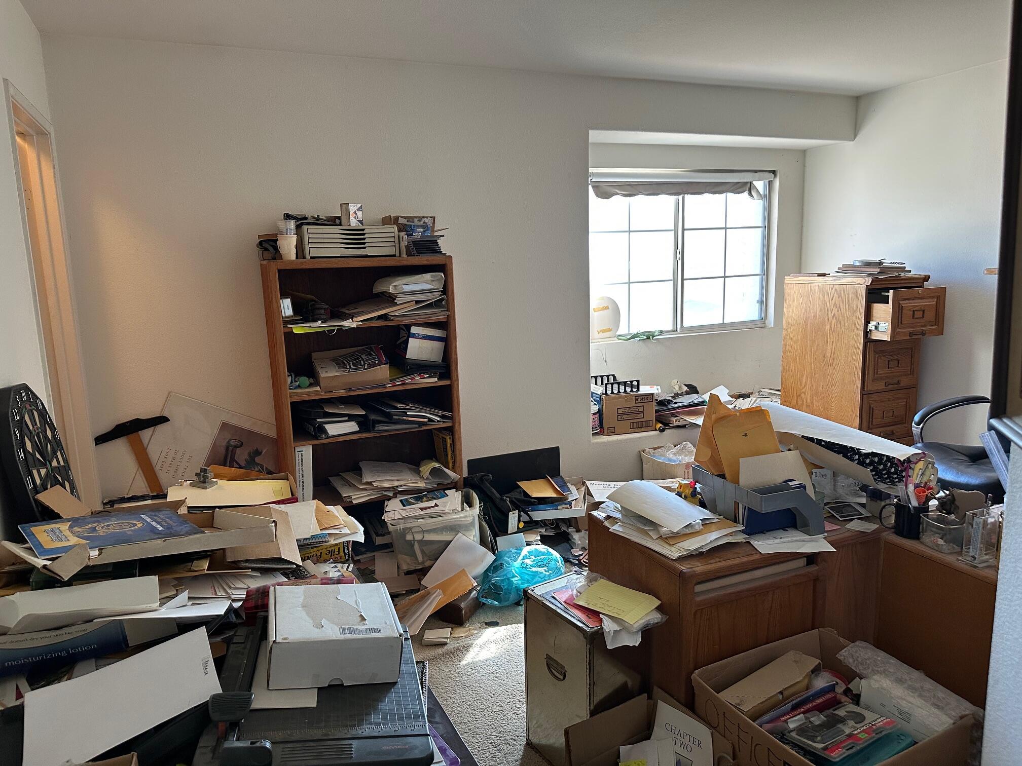 735 Blake Road Riverside, CA 92501 - Photo 17 of 24 a workspace with furniture and musical instruments