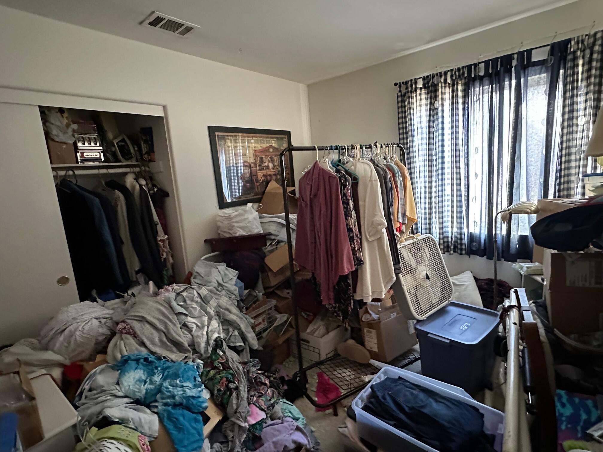 735 Blake Road Riverside, CA 92501 - Photo 8 of 24 a view of walk in closet with clothes and shoes