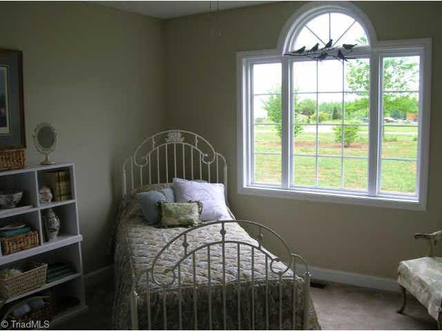 115 Roxie Road Stokesdale, NC 27357 - Photo 8 of 9 Other. Spacious 2nd bedroom w/large window to let lots of sunshine in