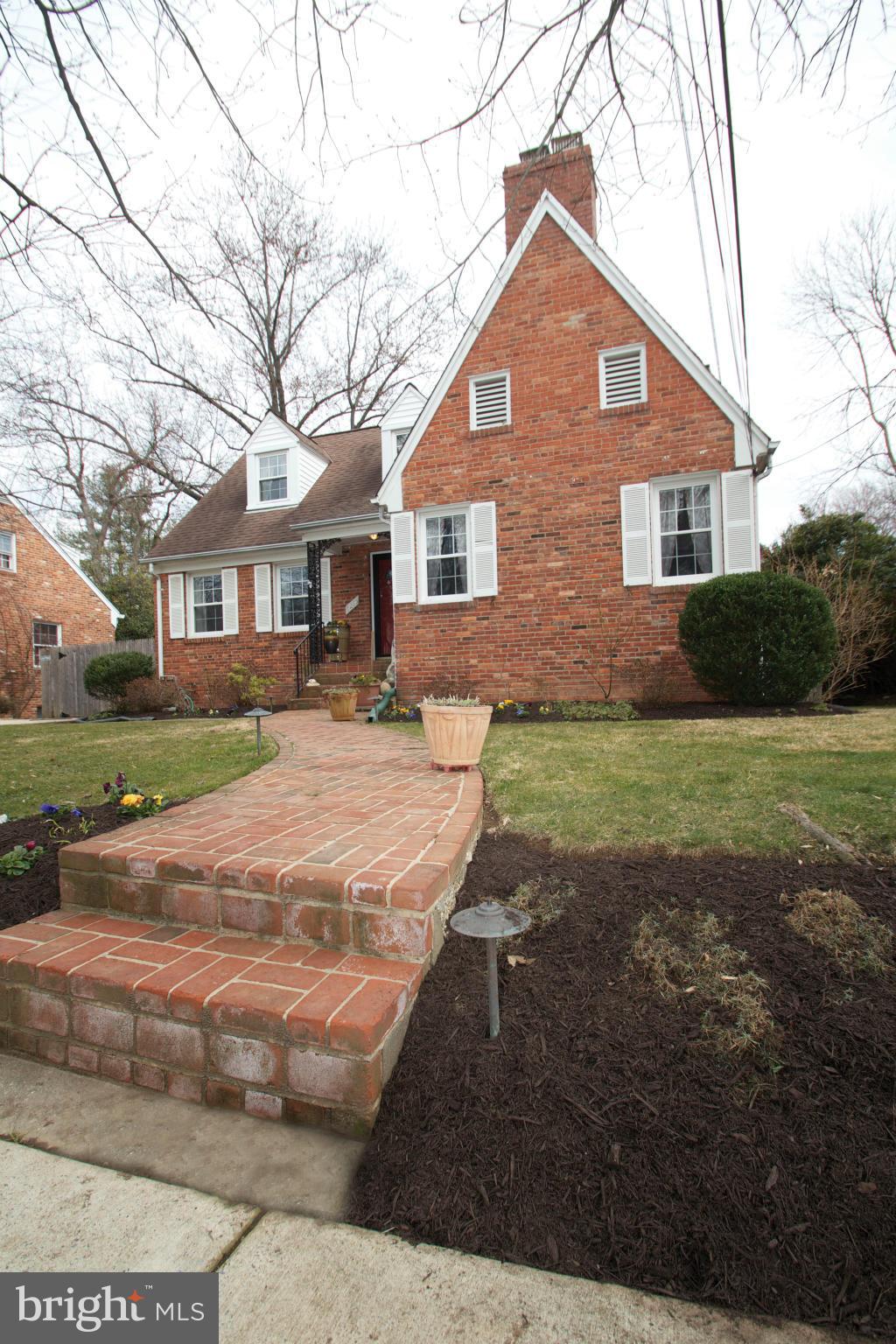 8215 Maple Ridge Road Bethesda, MD 20814 - Photo 2 of 23 a front view of house with yard