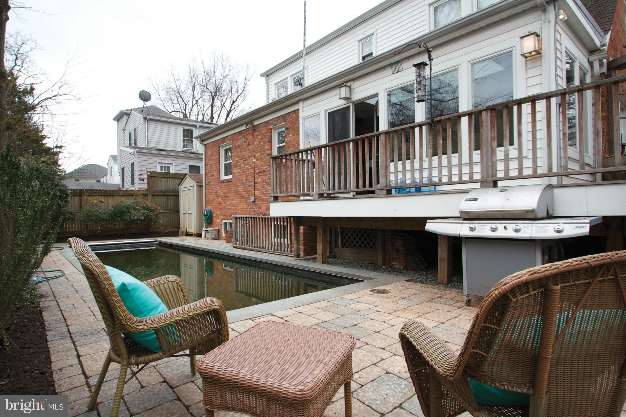 8215 Maple Ridge Road Bethesda, MD 20814 - Photo 16 of 23 a view of a patio with chairs and a table and chairs