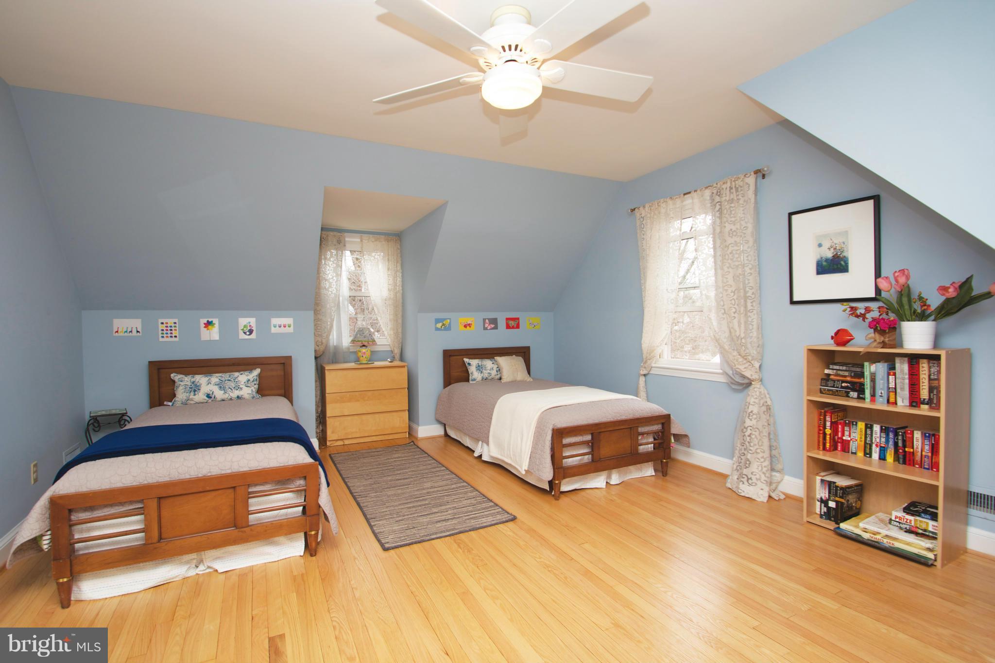 8215 Maple Ridge Road Bethesda, MD 20814 - Photo 19 of 23 a bedroom with a bed and a book shelf