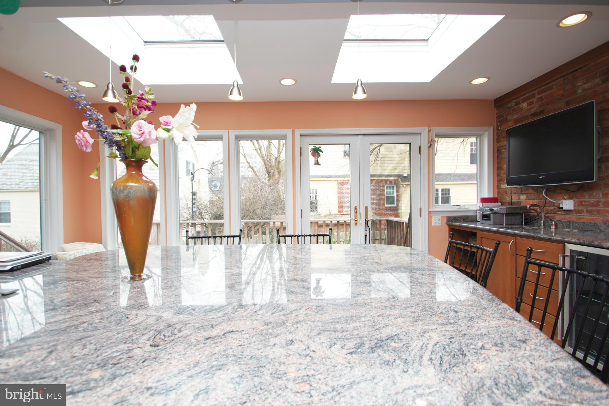 8215 Maple Ridge Road Bethesda, MD 20814 - Photo 5 of 23 a view of a living room and kitchen