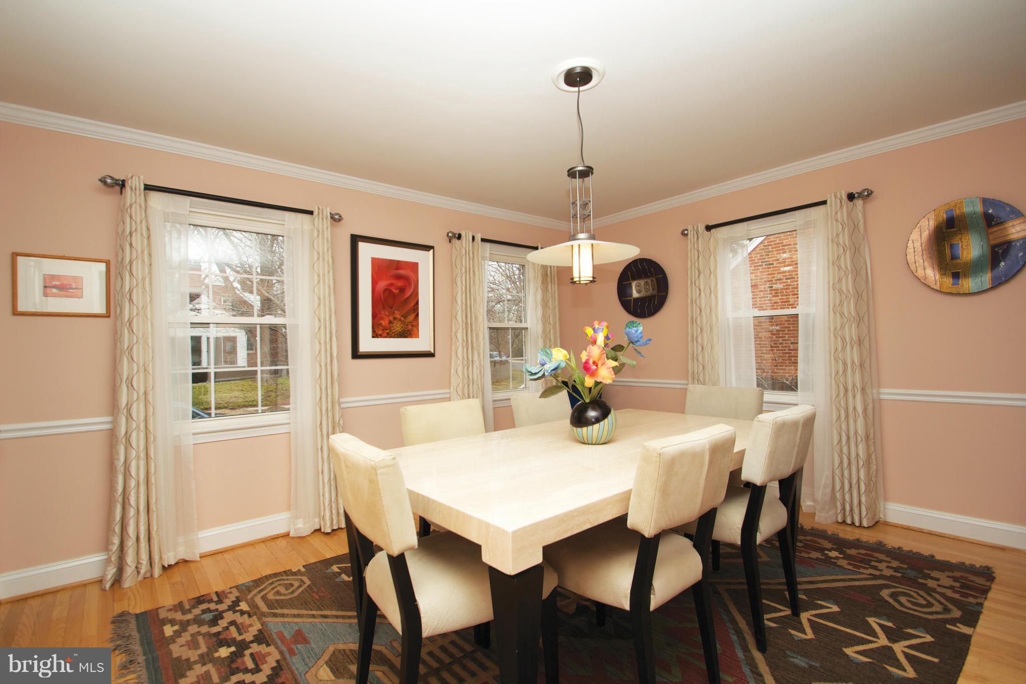 8215 Maple Ridge Road Bethesda, MD 20814 - Photo 7 of 23 a view of a dining room with furniture window and wooden floor