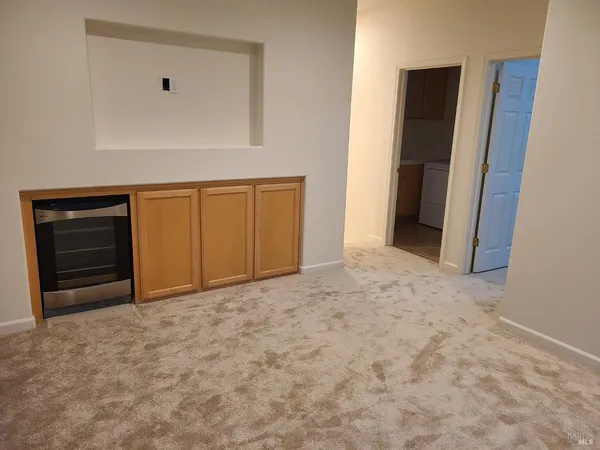 a view of an empty room and closet area