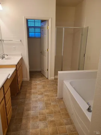 a bathroom with a bathtub and a sink