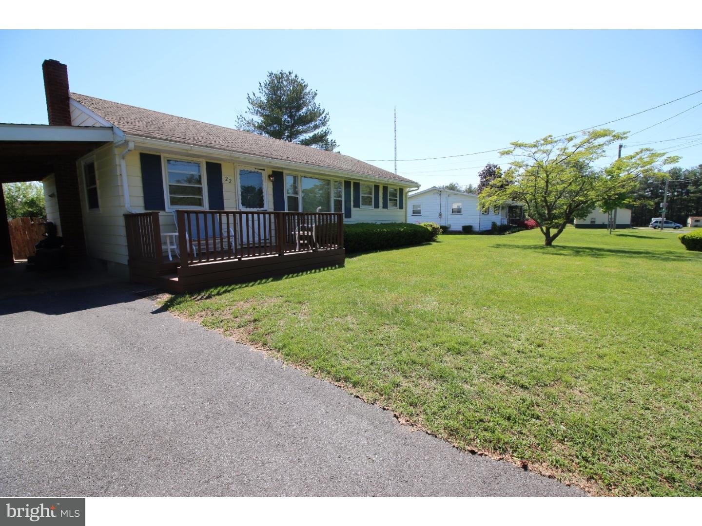 22 Nestler Road Bridgeton, NJ 08302 - Photo 3 of 14 a front view of house with yard and trees in the background
