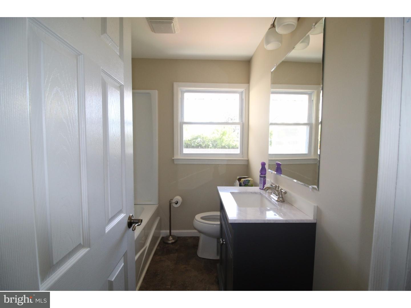 22 Nestler Road Bridgeton, NJ 08302 - Photo 8 of 14 a bathroom with a sink vanity and a mirror