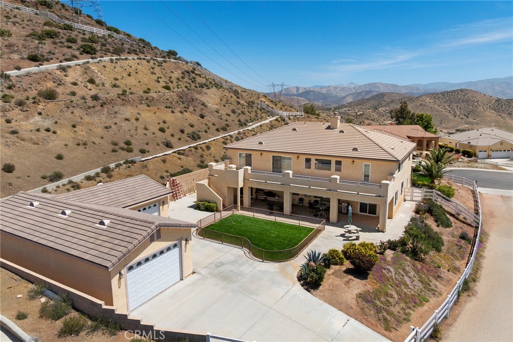 an aerial view of a house with a garden