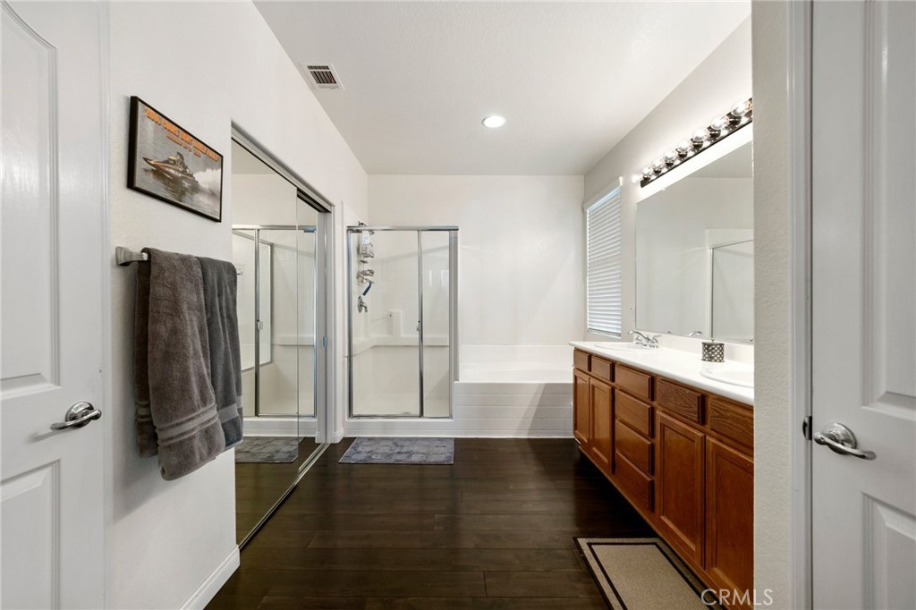 34695 Desert Road Acton, CA 93510 - Photo 19 of 68 a bathroom with a double vanity sink a mirror and a shower