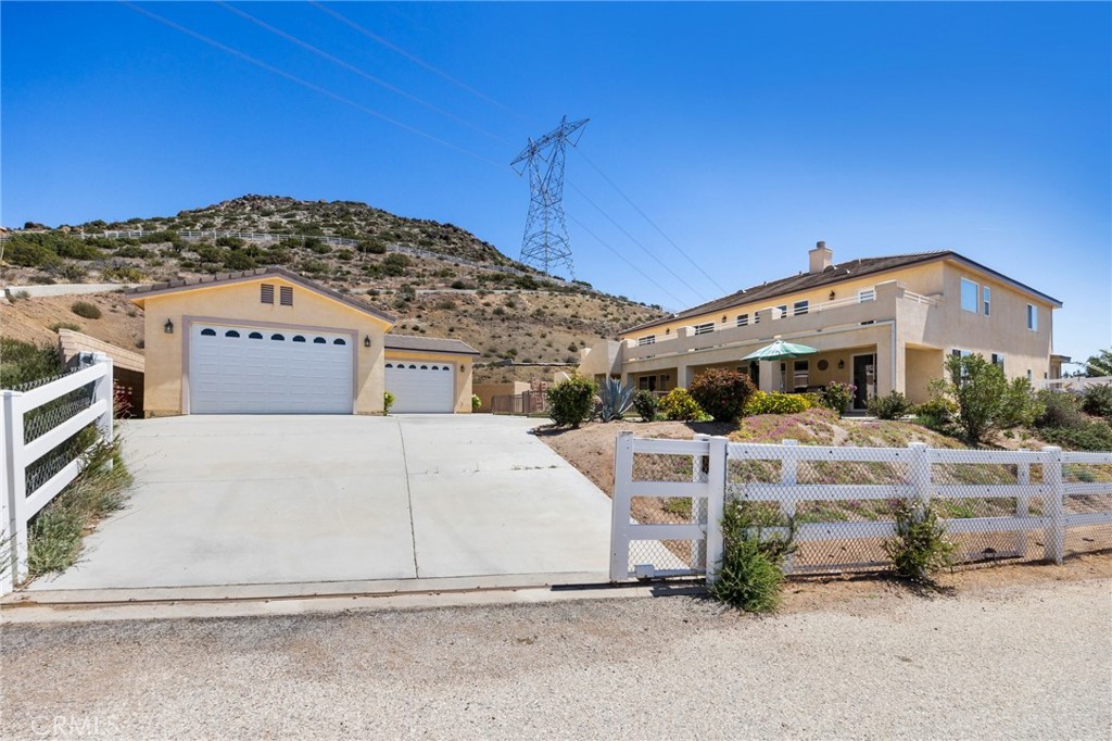 34695 Desert Road Acton, CA 93510 - Photo 2 of 68 a front view of a house with a yard