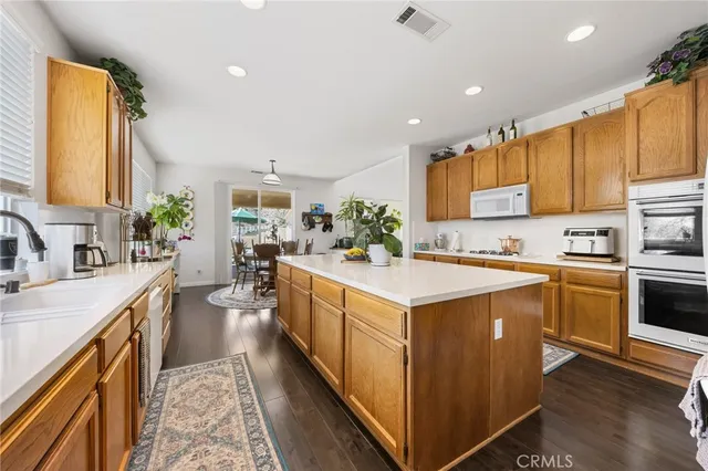 a bathroom with a sink a toilet and shower curtain