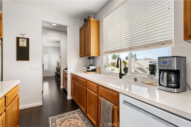 a living room with furniture a rug and white walls