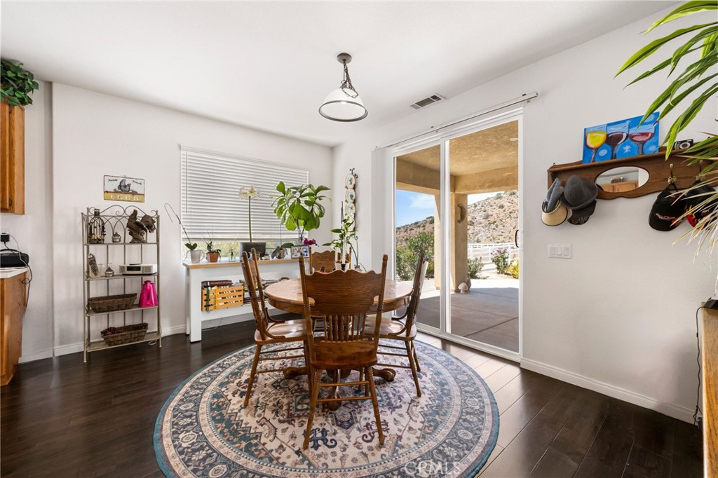 34695 Desert Road Acton, CA 93510 - Photo 38 of 68 a view of a dining room with furniture and a window
