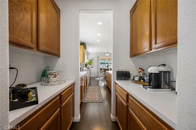 a view of a room with wooden floor and bench