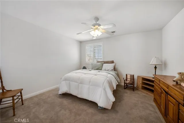 an aerial view of a house with a mountain