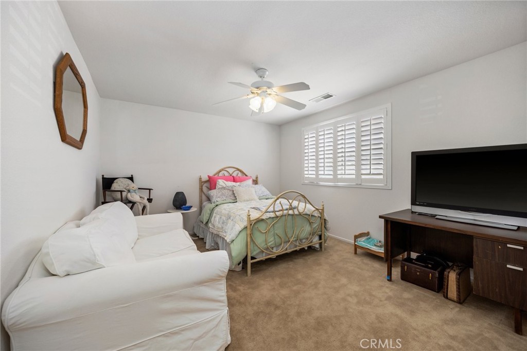 34695 Desert Road Acton, CA 93510 - Photo 49 of 68 a bedroom with a bed and a flat screen tv