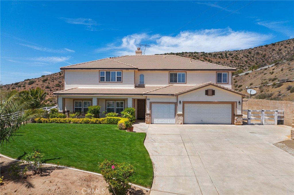 34695 Desert Road Acton, CA 93510 - Photo 67 of 68 a front view of a house with a garden and yard