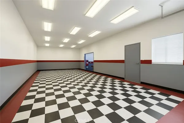 a room with gym equipment and a large window