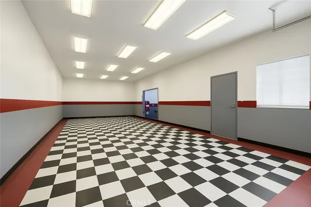 a room with gym equipment and a large window