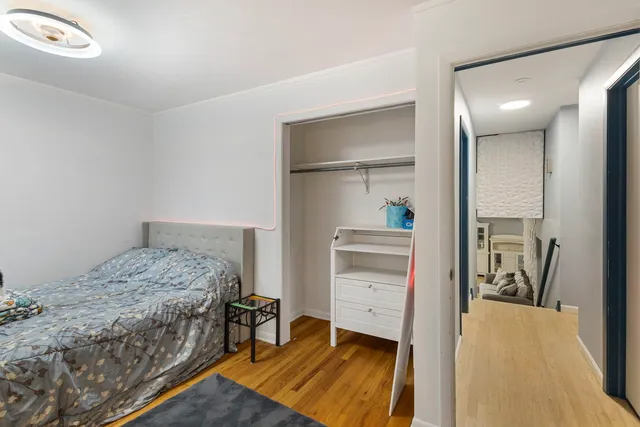 a bedroom with a bed and a view of bathroom