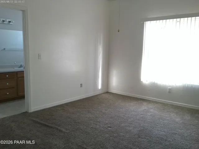 a view of an empty room and window